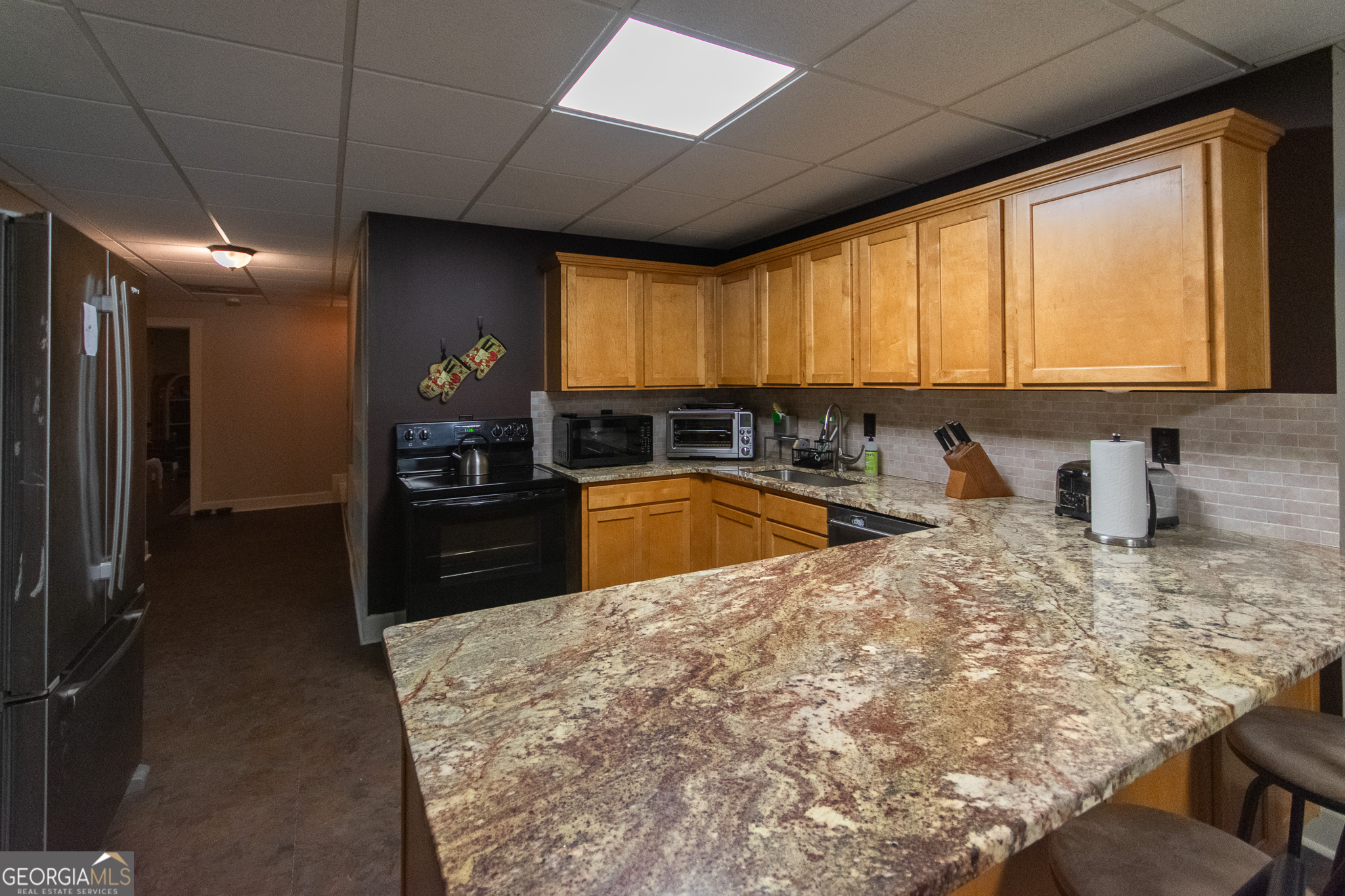 190 Carl Williams Road Senoia, GA 30276 - Photo 55 of 93 a large kitchen with kitchen island granite countertop a large window