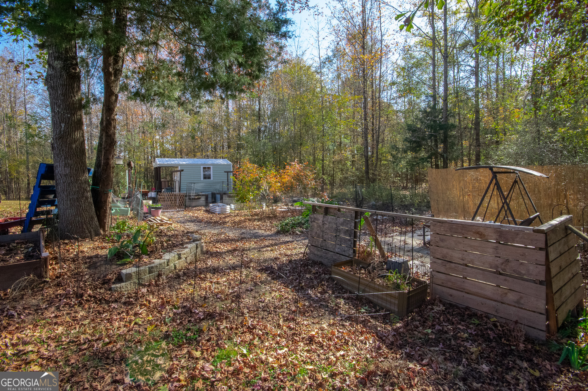 190 Carl Williams Road Senoia, GA 30276 - Photo 86 of 93 a view of a backyard with plants and a patio