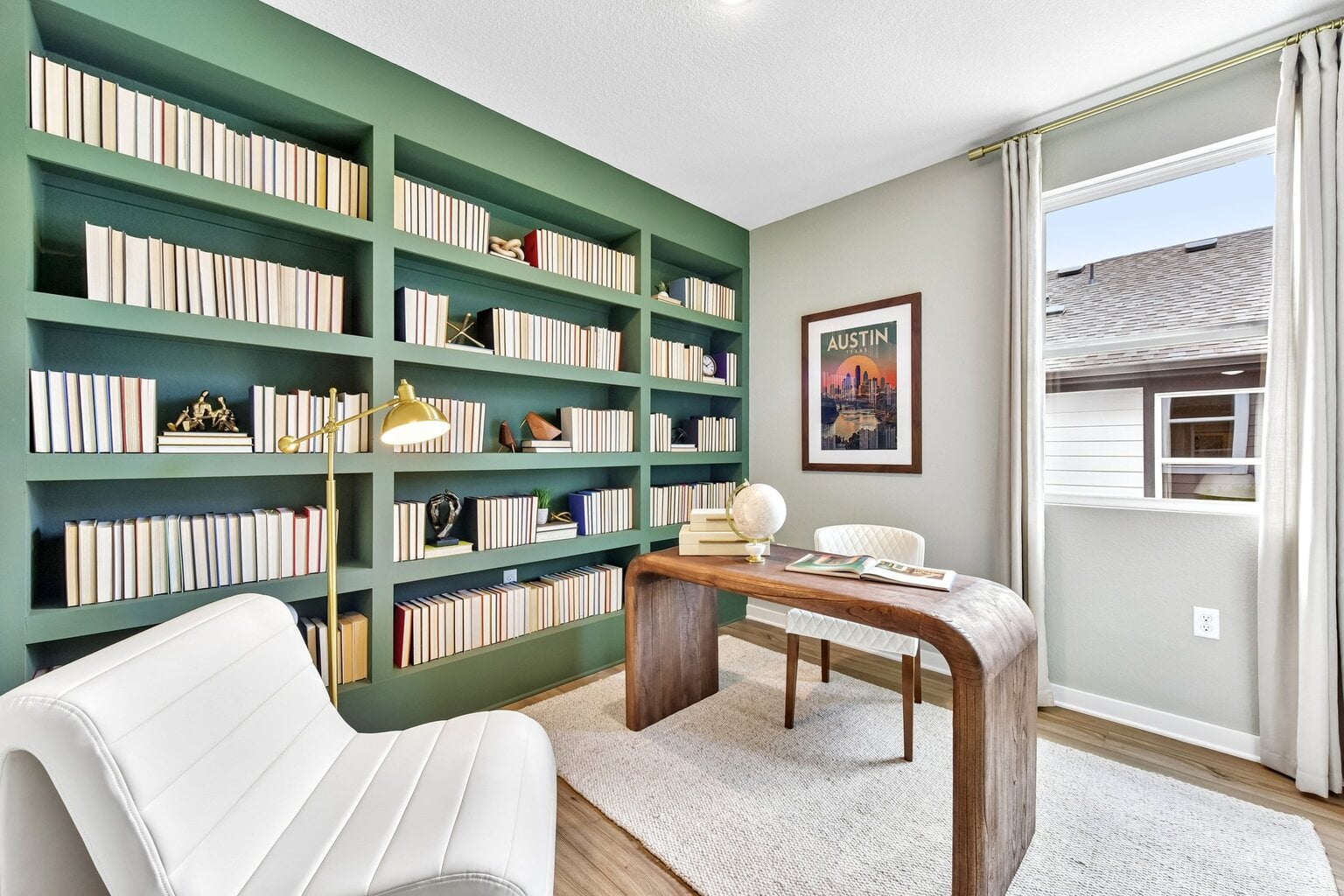10609 Trifecta Way Buda, TX 78610 - Photo 9 of 17 Built-in shelving creates a distinguished study, perfect for quiet work or reading.