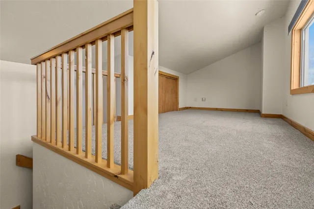 a view of a porch with wooden floor