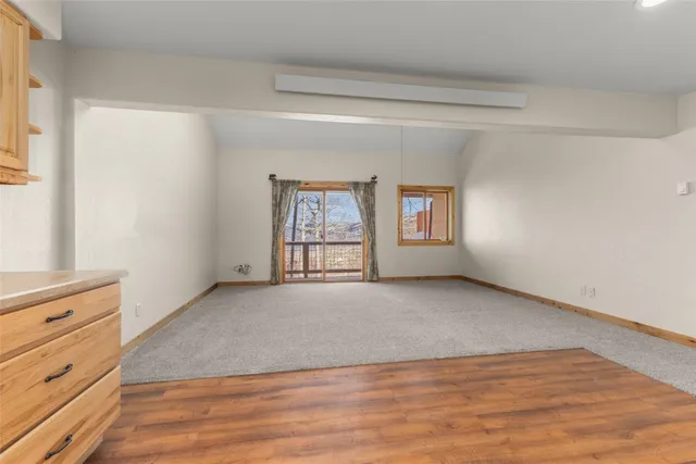 a view of an empty room and window