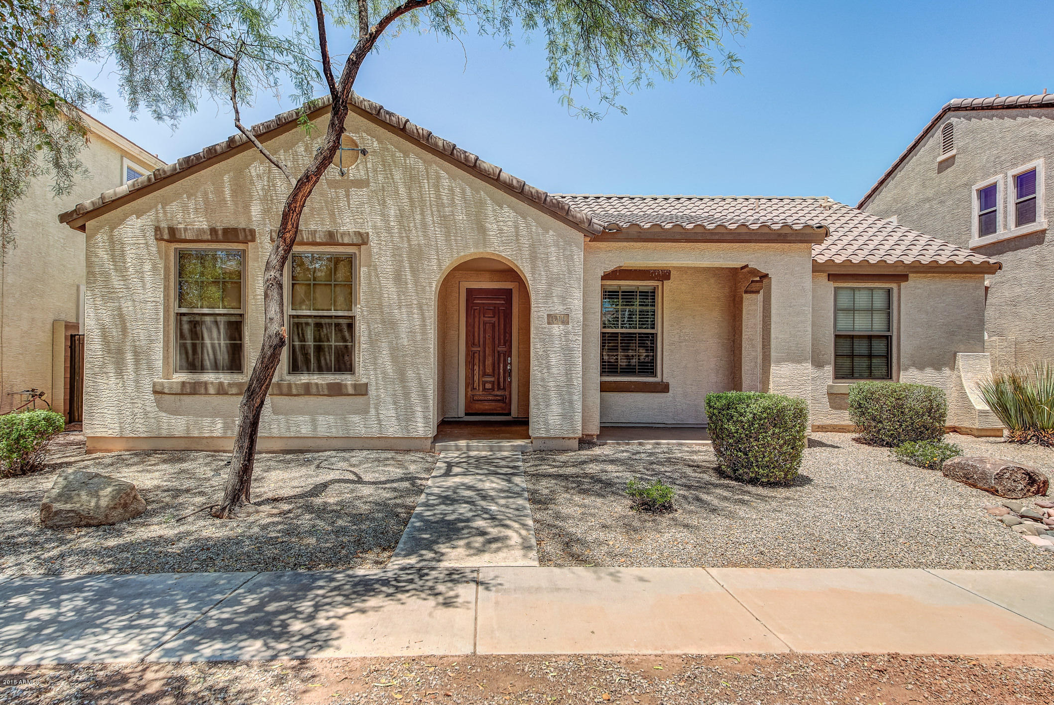 1714 South Rochester Drive Gilbert, AZ 85295 - Photo 1 of 51 a front view of a house