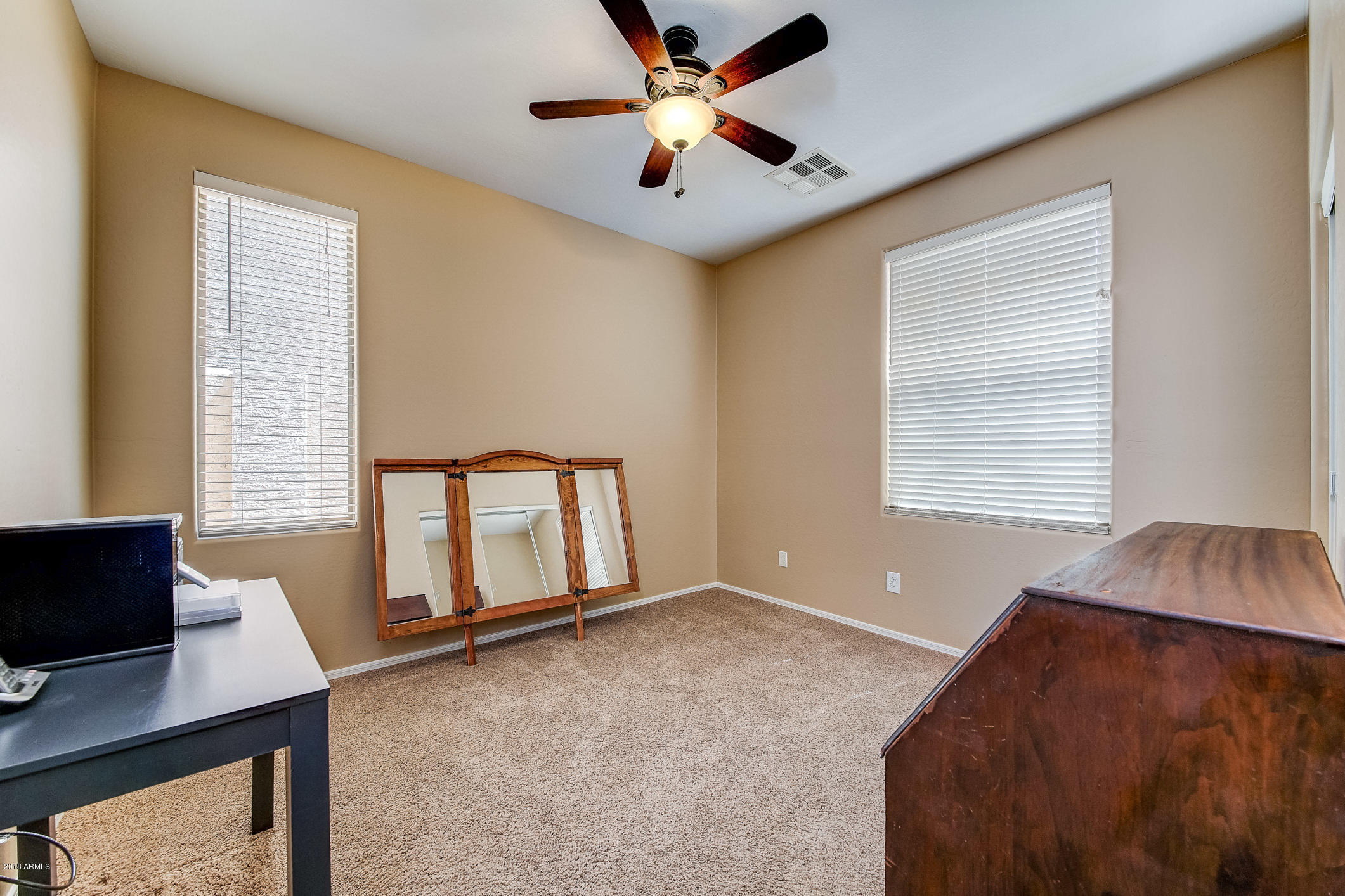 1714 South Rochester Drive Gilbert, AZ 85295 - Photo 33 of 51 a living room with furniture and a window