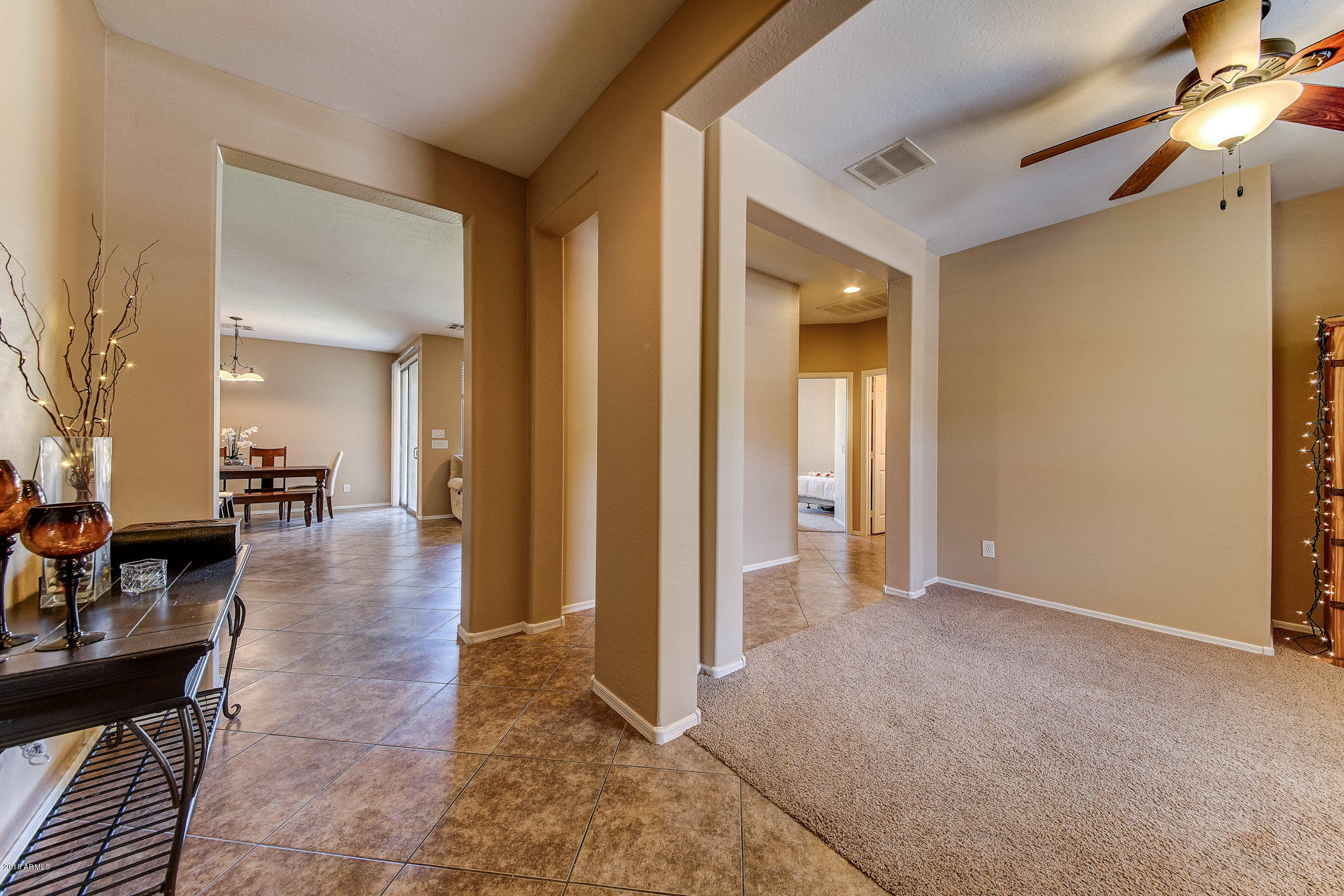 1714 South Rochester Drive Gilbert, AZ 85295 - Photo 8 of 51 a view of a livingroom kitchen and dinning room