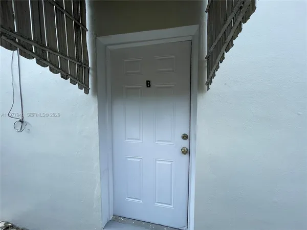 a view of staircase with white walls