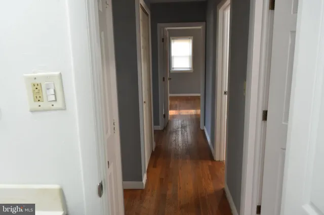 a bathroom with a shower a toilet and a sink
