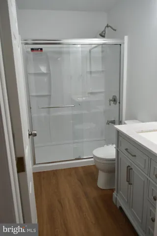 a bathroom with a shower and a toilet