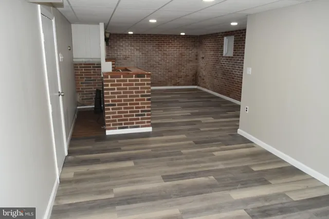 a brick house with a yard