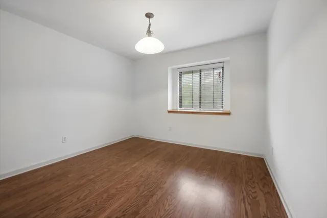 a view of a dining room with furniture and window