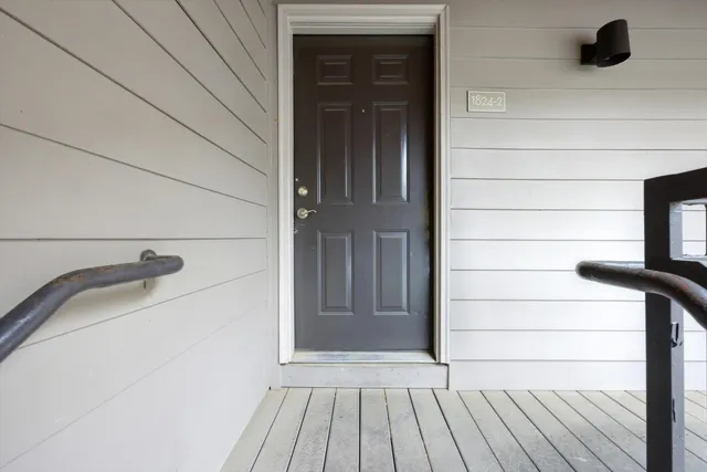 a view of entryway with wooden floor
