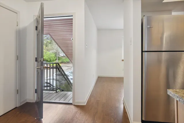 a kitchen with stainless steel appliances granite countertop a stove a sink and a large window