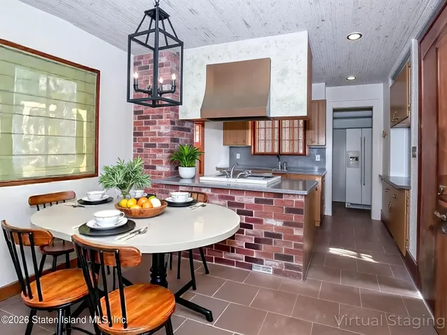 a outdoor dining space with furniture and a potted plant