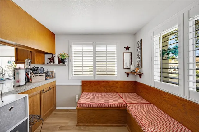 a kitchen that has a sink and a chair in it