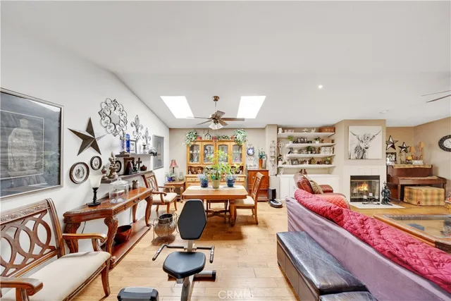 a living room with furniture gym equipment and a fireplace