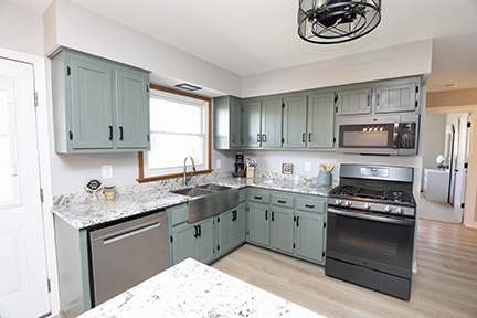 100 Lee Street Manhattan, IL 60442 - Photo 6 of 21 a kitchen with stainless steel appliances granite countertop a sink stove a refrigerator and a microwave oven