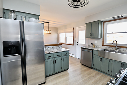 100 Lee Street Manhattan, IL 60442 - Photo 7 of 21 a kitchen with stainless steel appliances granite countertop a refrigerator a sink a stove and island