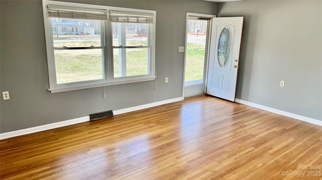 6440 Miller Road Kannapolis, NC 28081 - Photo 3 of 15 a view of a livingroom with wooden floor and a window
