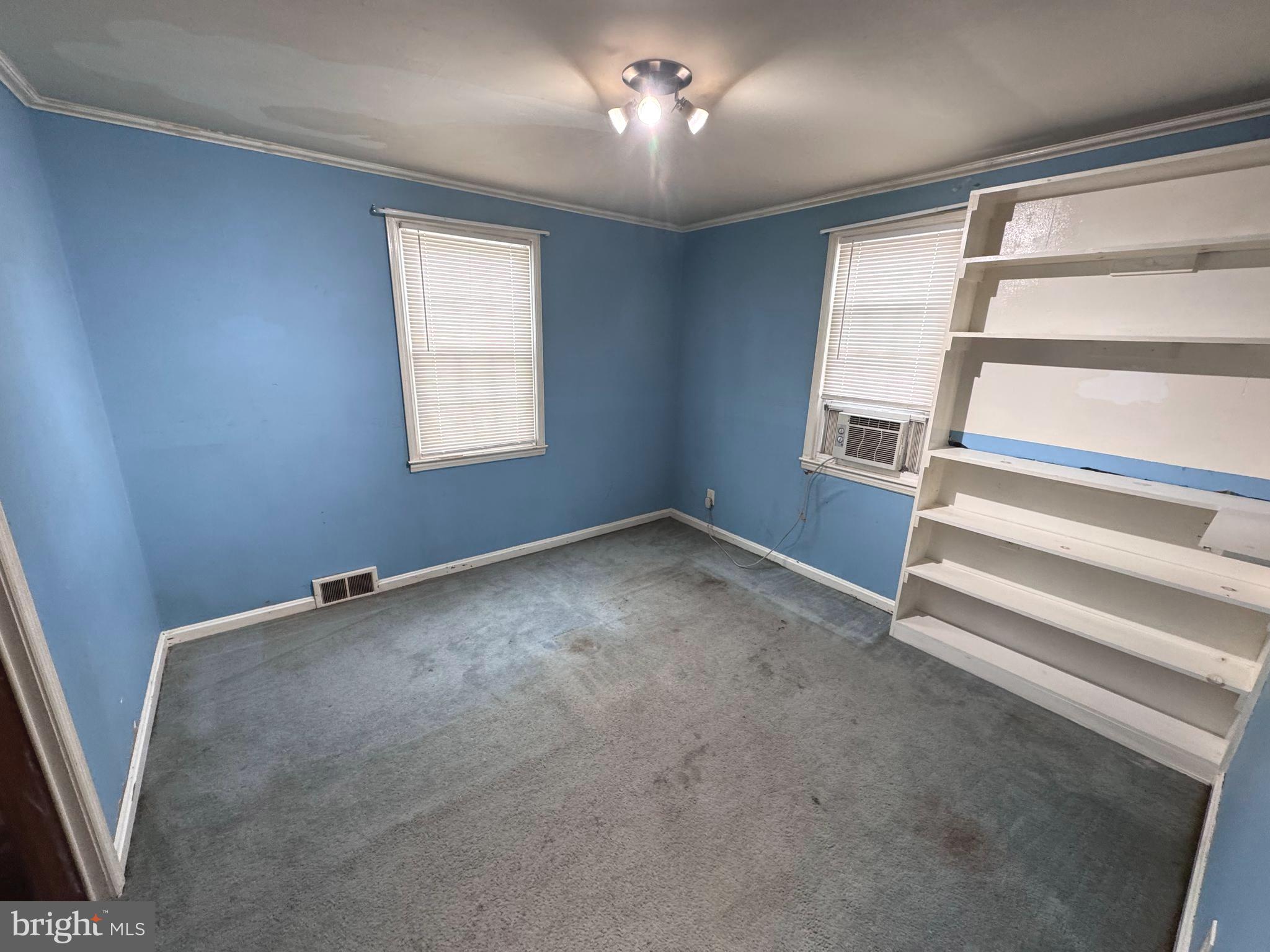 1705 Summit Avenue Baltimore, MD 21227 - Photo 5 of 7 a view of room with stairs and a window