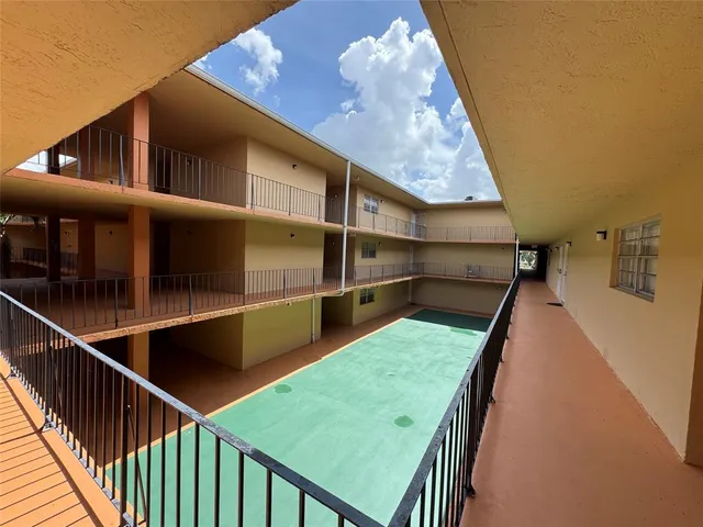 a view of a balcony with chairs