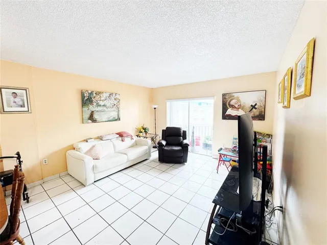 a bedroom with furniture and a wooden floor