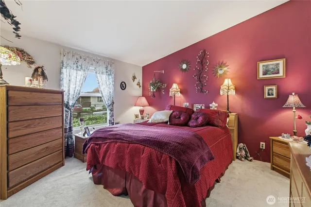 a bedroom with a bed and a dresser