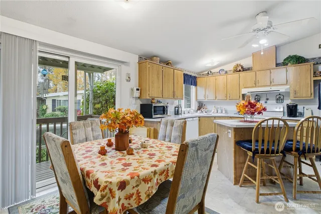 a view of a dining room with furniture window and outside view
