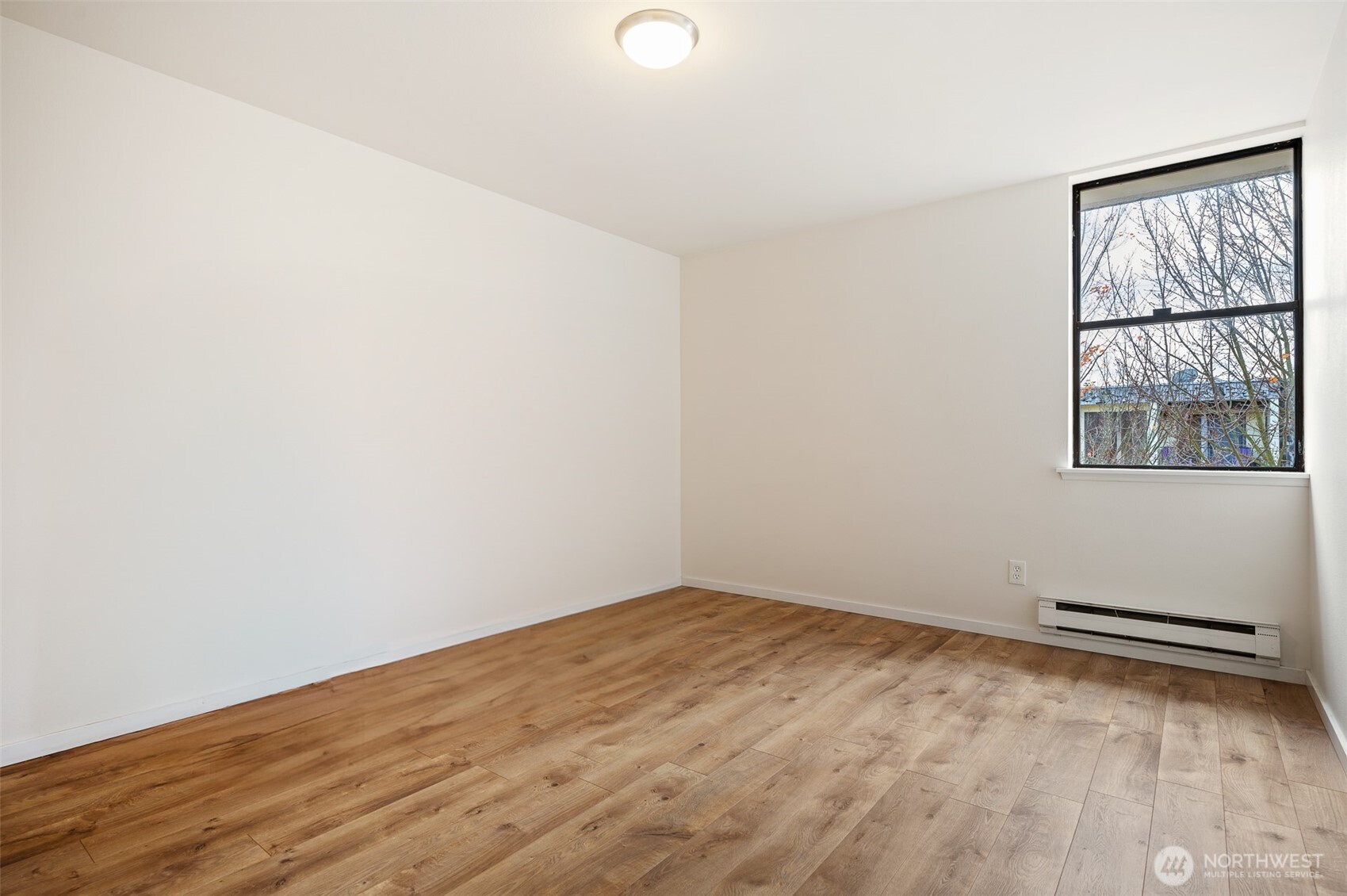 802 North 43rd Street Seattle, WA 98103 - Photo 13 of 18 an empty room with a window