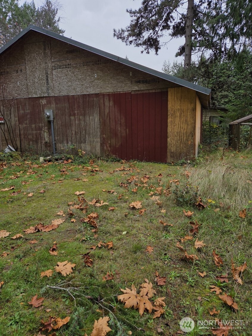 15820 62nd Avenue Northwest Gig Harbor, WA 98332 - Photo 5 of 7 a backyard of a house