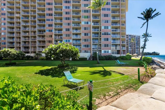 a swimming pool with barbeque outdoor seating and yard