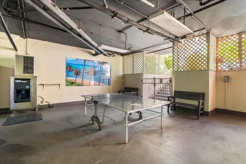 a living room with furniture a window and a table