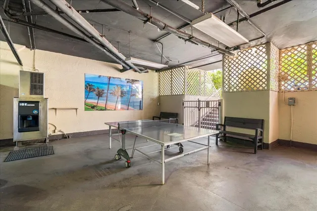 a living room with furniture a window and a table