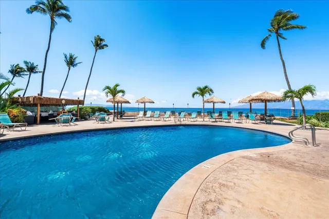 a view of a swimming pool and a chairs