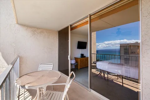 a reading room with furniture and wooden floor