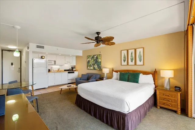 a living room with a bed furniture and a window