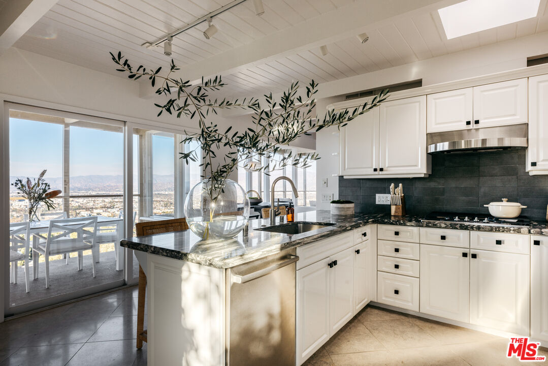 3272 Wrightwood Drive Studio City, CA 91604 - Photo 11 of 36 a kitchen with a sink cabinets and window