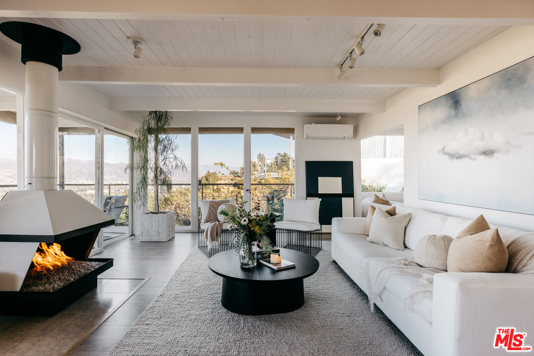 3272 Wrightwood Drive Studio City, CA 91604 - Photo 13 of 36 a living room with furniture and a fireplace