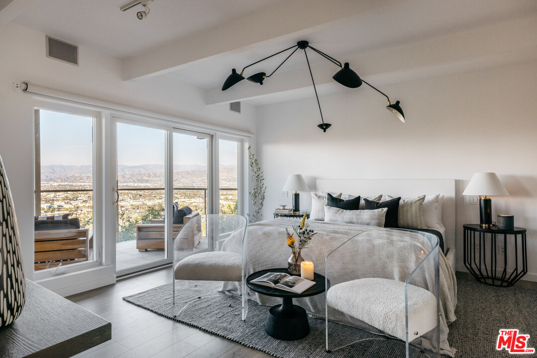 3272 Wrightwood Drive Studio City, CA 91604 - Photo 16 of 36 a bedroom with furniture and large windows