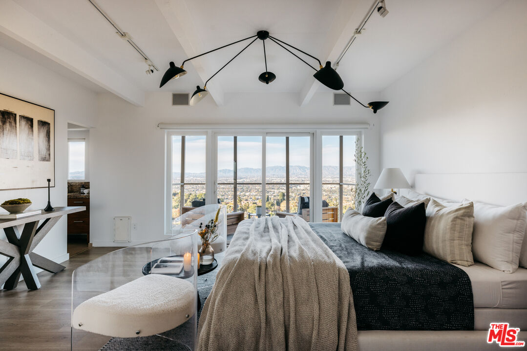 3272 Wrightwood Drive Studio City, CA 91604 - Photo 18 of 36 a bed room with a bed and a large window