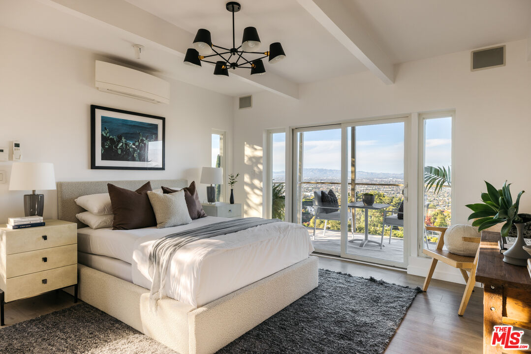 3272 Wrightwood Drive Studio City, CA 91604 - Photo 22 of 36 a bedroom with a large bed and a window