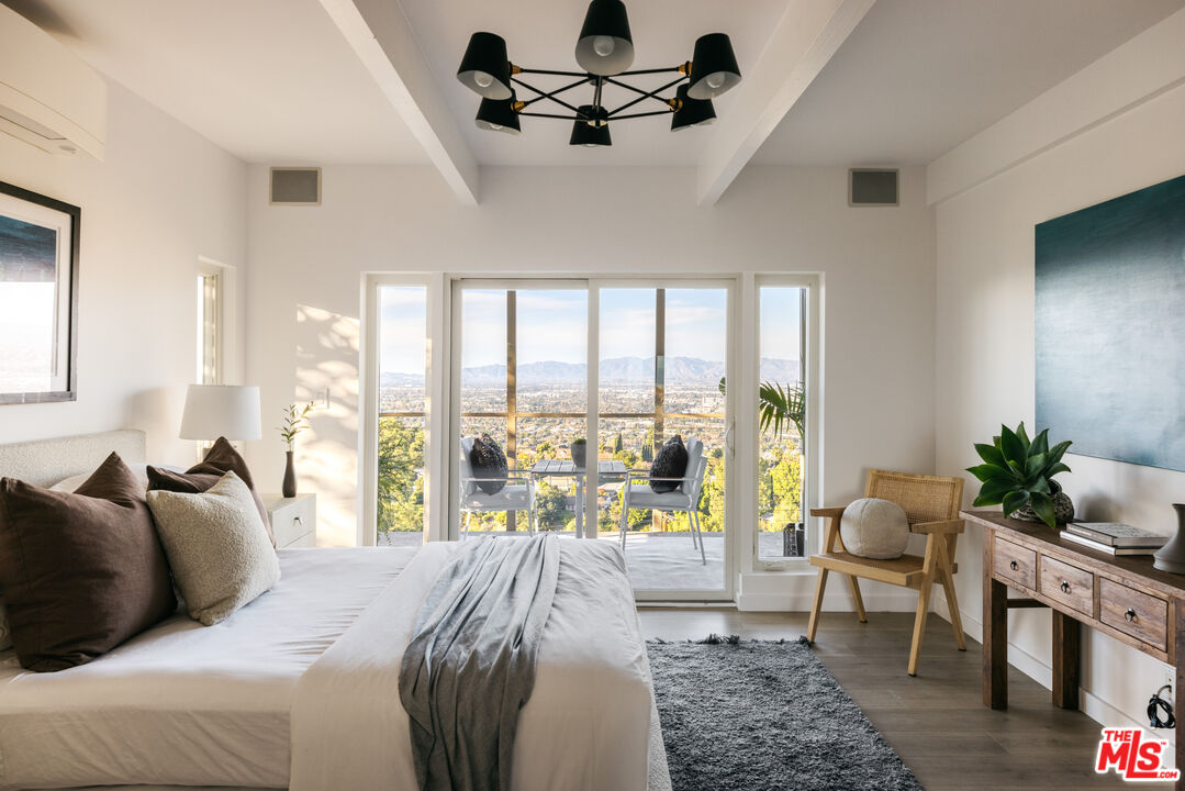 3272 Wrightwood Drive Studio City, CA 91604 - Photo 23 of 36 a bedroom with a bed couch and large windows