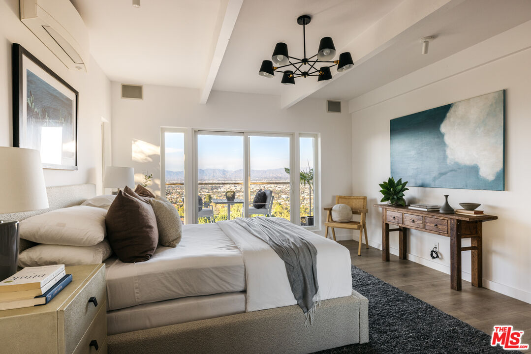 3272 Wrightwood Drive Studio City, CA 91604 - Photo 24 of 36 a bedroom with a bed couches and a flat tv screen