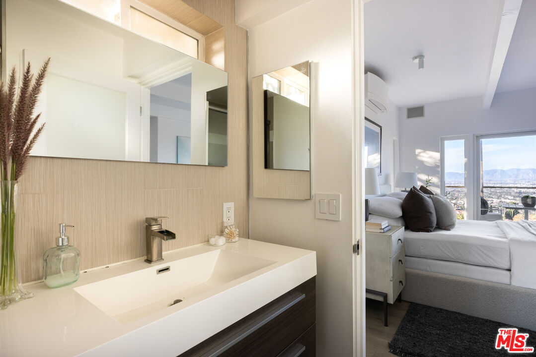 3272 Wrightwood Drive Studio City, CA 91604 - Photo 25 of 36 a bathroom with a sink and a mirror