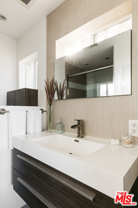 3272 Wrightwood Drive Studio City, CA 91604 - Photo 26 of 36 a bathroom with a sink and a mirror