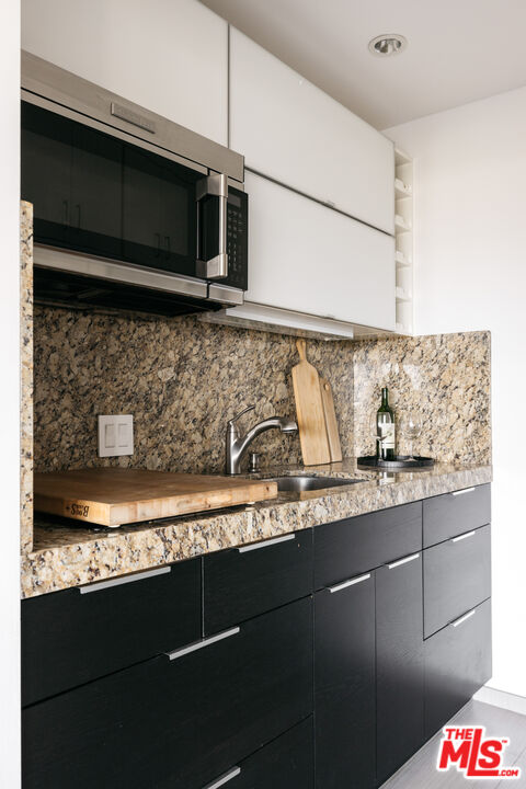 3272 Wrightwood Drive Studio City, CA 91604 - Photo 27 of 36 a kitchen with a sink and cabinets