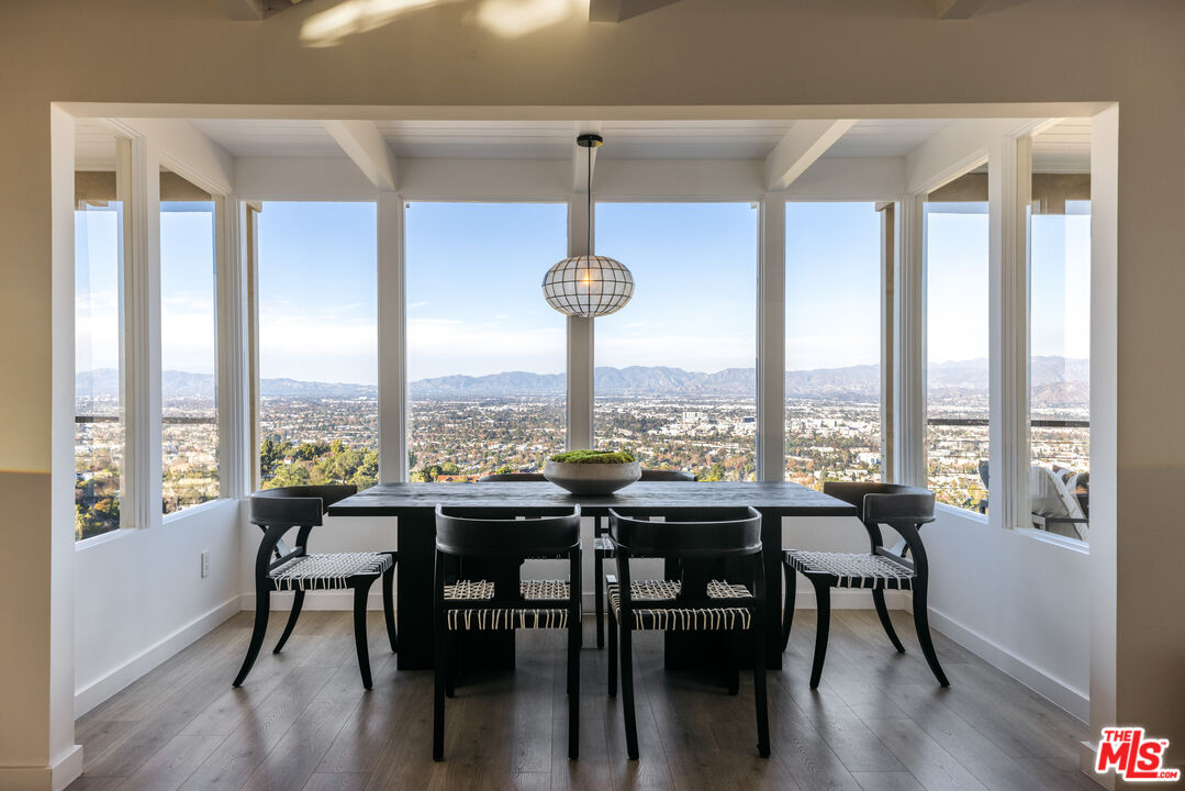 3272 Wrightwood Drive Studio City, CA 91604 - Photo 7 of 36 a view of a dining room with furniture window and wooden floor