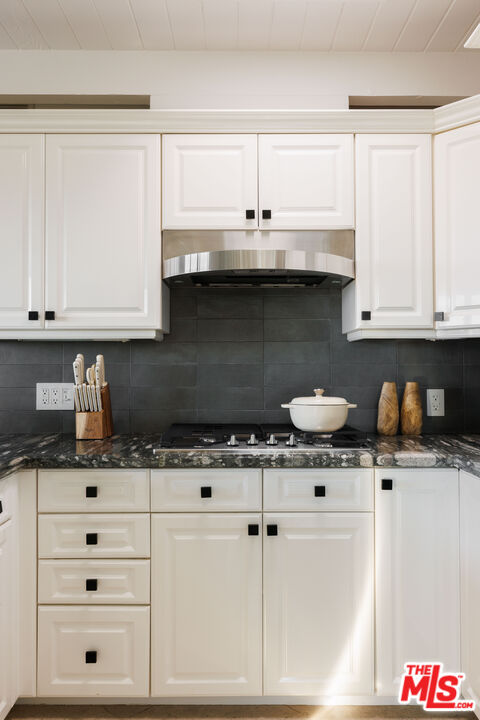 3272 Wrightwood Drive Studio City, CA 91604 - Photo 10 of 36 a kitchen with granite countertop a sink a stove and cabinets