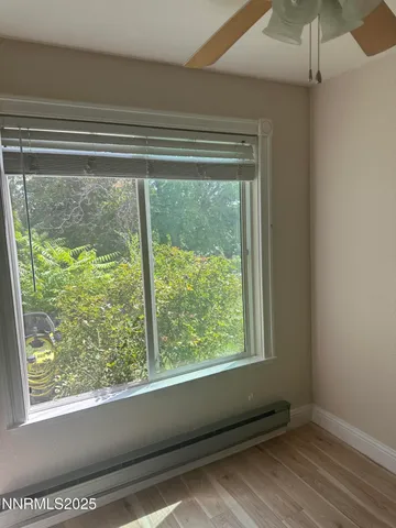 a view of a room that has a window