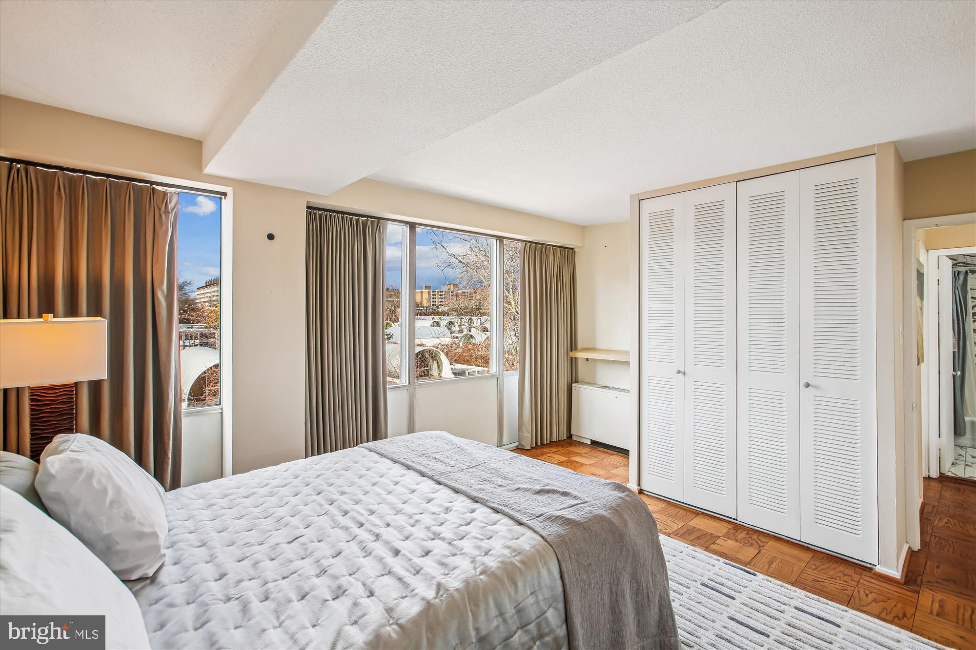 1311 Delaware Avenue Southwest, Unit S331 Washington, DC 20024 - Photo 15 of 35 a bedroom with a bed and a window
