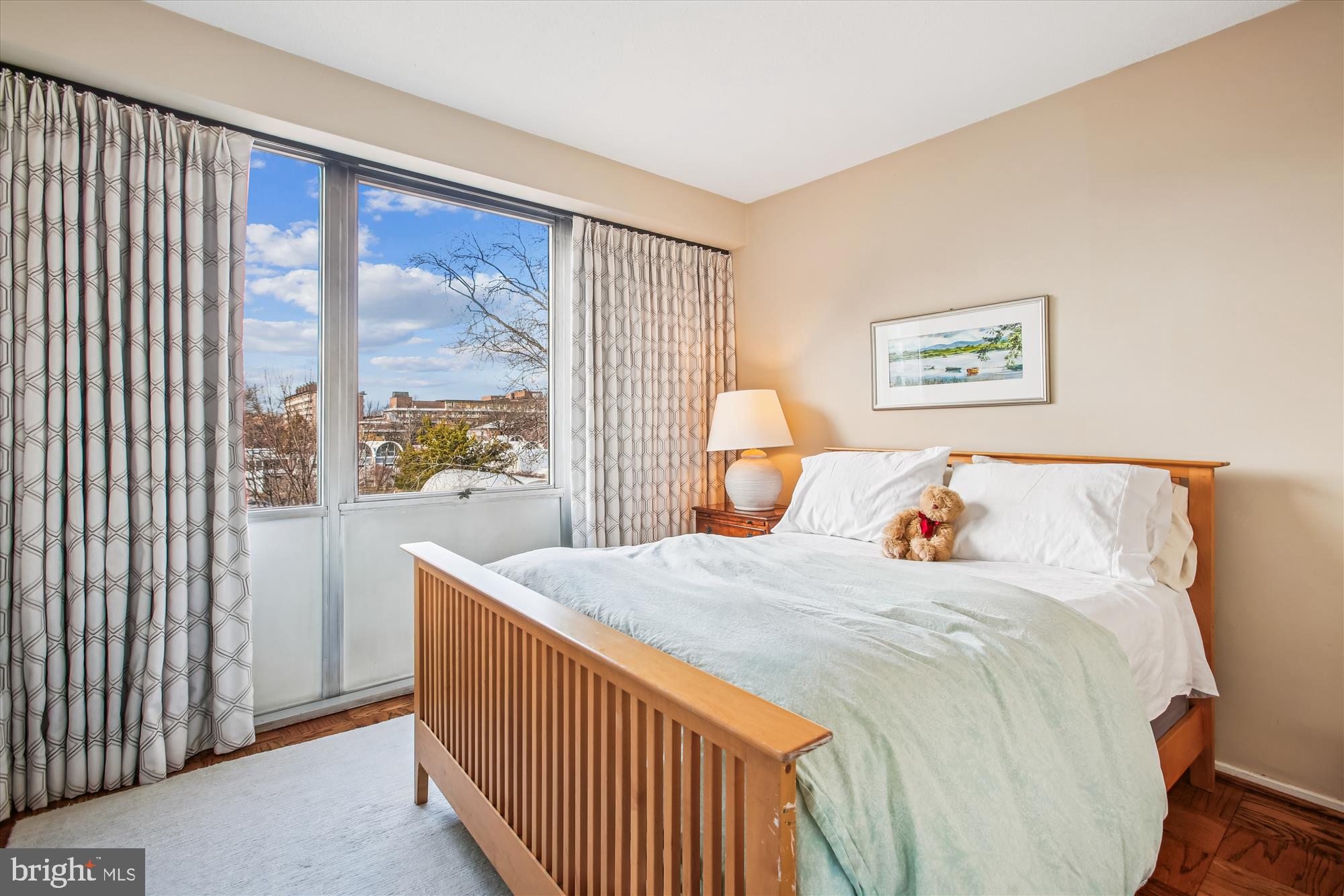 1311 Delaware Avenue Southwest, Unit S331 Washington, DC 20024 - Photo 19 of 35 a bedroom with a bed and a large window