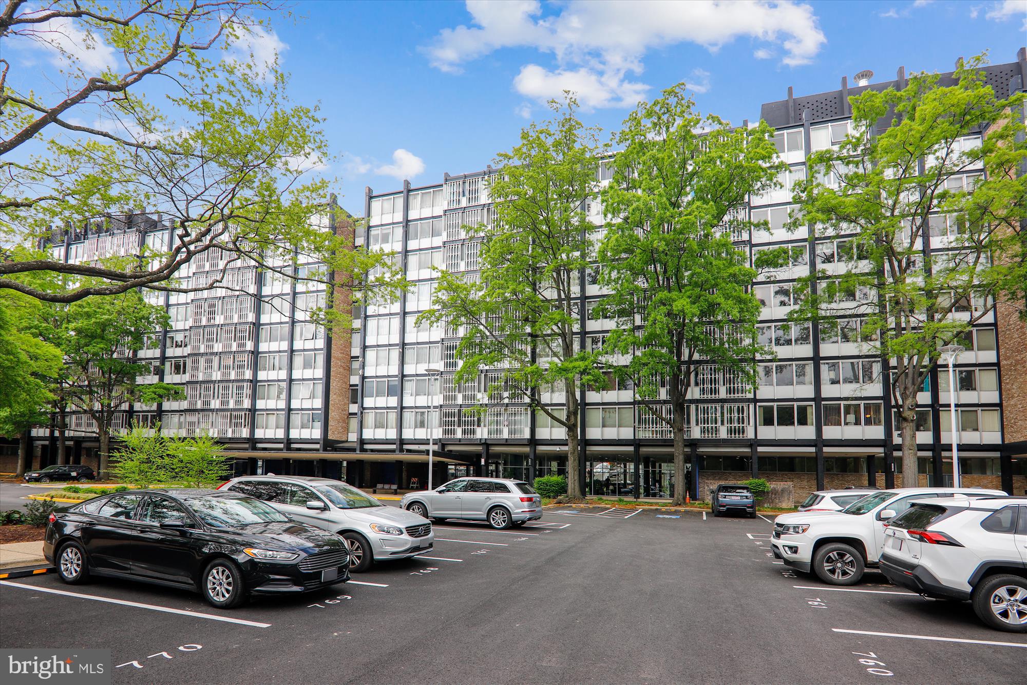 1311 Delaware Avenue Southwest, Unit S331 Washington, DC 20024 - Photo 24 of 35 a cars parked in front of a building